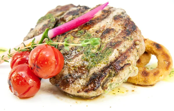 Grilled steak with sauce and greens — Stock Photo, Image