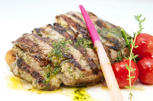 Grilled steak with sauce and greens — Stock Photo, Image