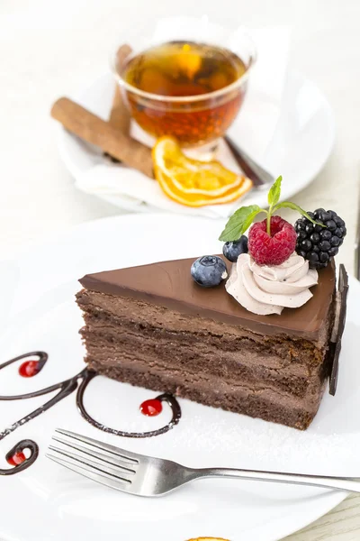Prague piece of cake decorated with raspberries — Stock Photo, Image