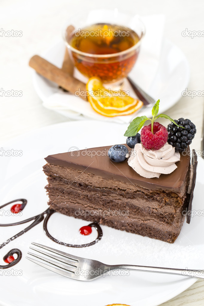 Prague piece of cake decorated with raspberries