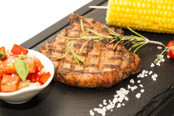 Steak with sauce and greens — Stock Photo, Image