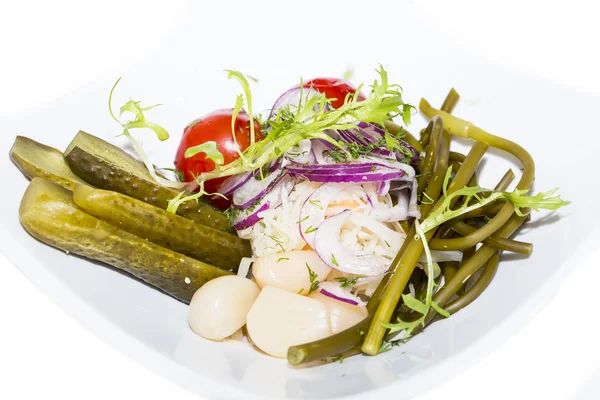 Pickled vegetables, cucumber tomatoes asparagus and garlic cabbage — Stock Photo, Image