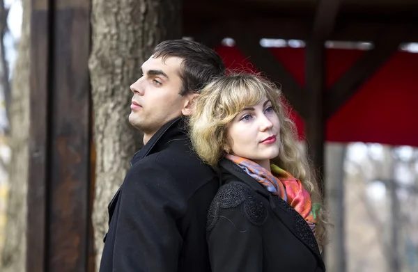 Boy and a girl in the autumn park — Stock Photo, Image