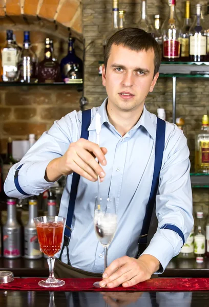 Young man working as a bartender — Stock Photo, Image