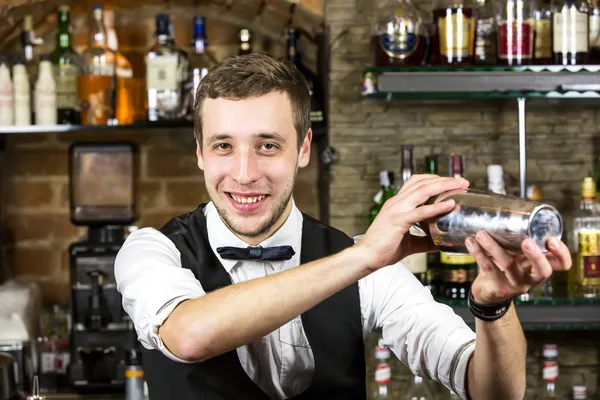 Young man working as a bartender — Stock Photo, Image