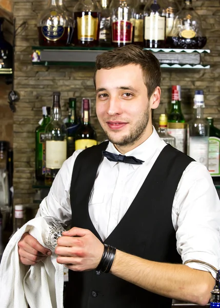 Young man working as a bartender — Stock Photo, Image