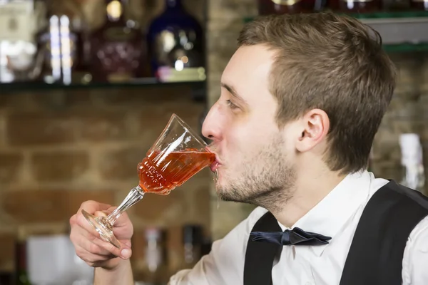 Young man working as a bartender — Stock Photo, Image