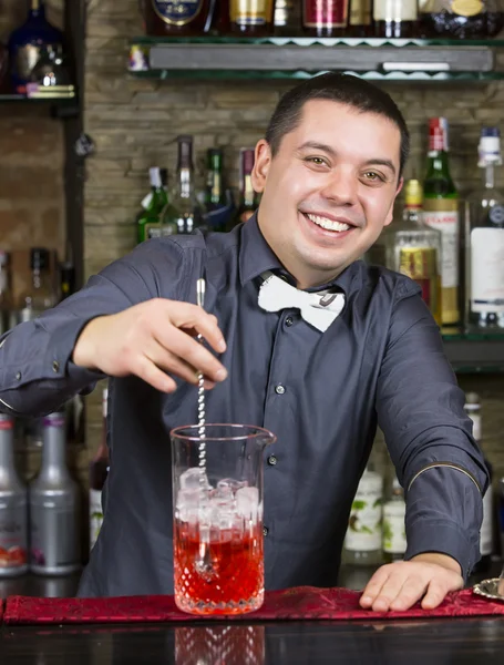 Young man working as a bartender — Stock Photo, Image