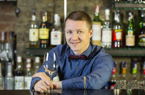 Young man working as a bartender — Stock Photo, Image