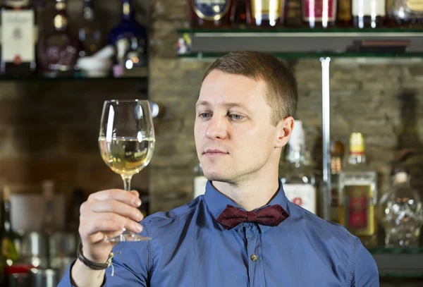 Young man working as a bartender — Stock Photo, Image