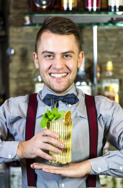 Young man working as a bartender — Stock Photo, Image