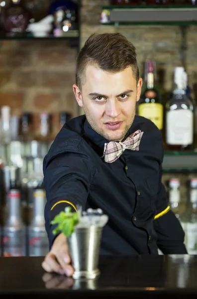 Young man working as a bartender — Stock Photo, Image