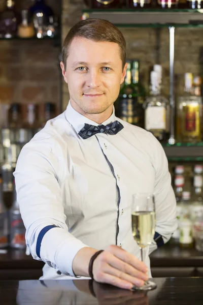 Young man working as a bartender — Stock Photo, Image