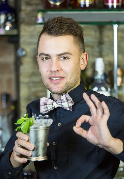 Young man working as a bartender — Stock Photo, Image
