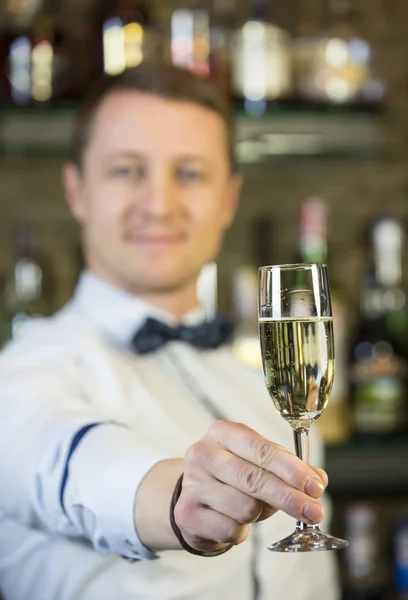 Young man working as a bartender — Stock Photo, Image