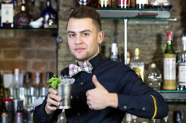 Young man working as a bartender — Stock Photo, Image