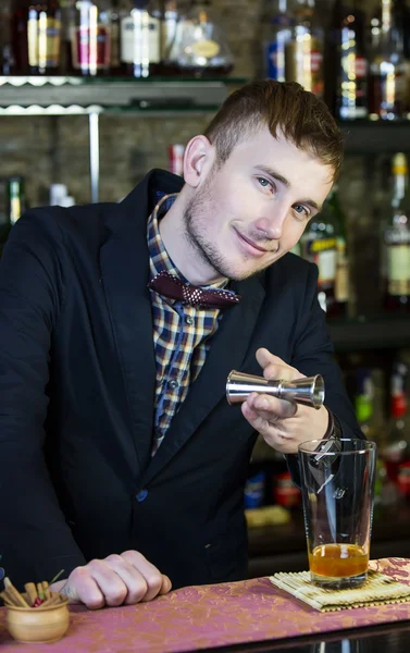 Young man working as a bartender — Stock Photo, Image