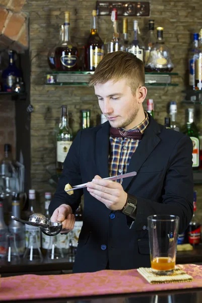 Young man working as a bartender — Stock Photo, Image