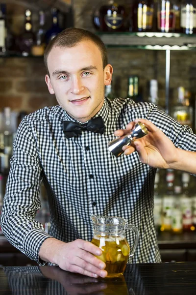 Young man working as a bartender — Stock Photo, Image