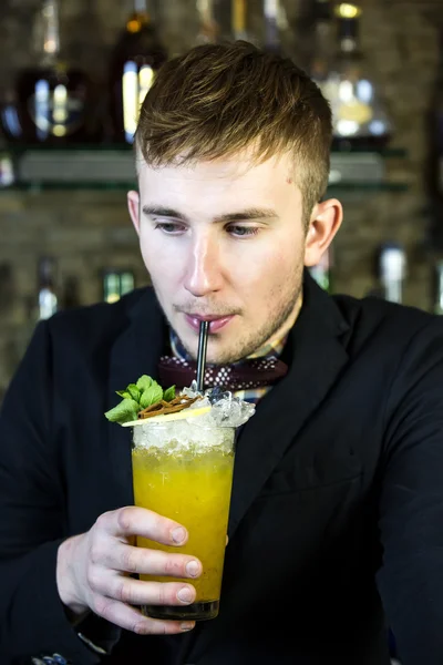 Young man working as a bartender — Stock Photo, Image