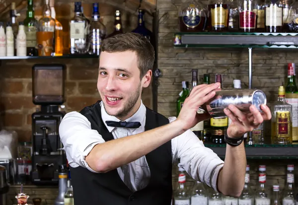 Young man working as a bartender — Stock Photo, Image