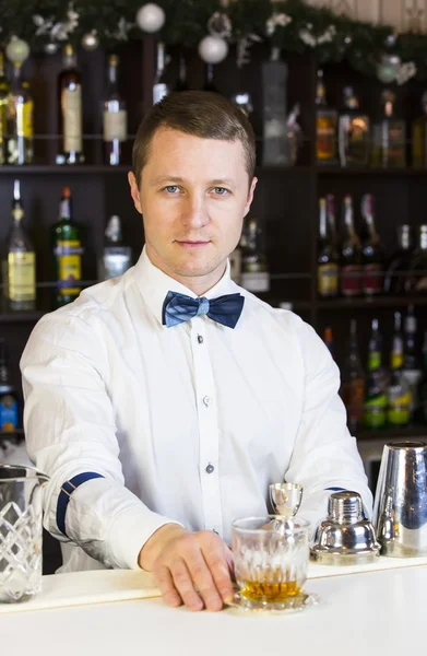 Young man working as a bartender — Stock Photo, Image