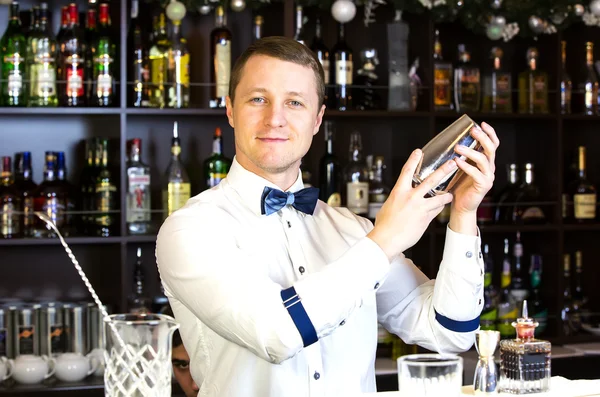 Young man working as a bartender — Stock Photo, Image