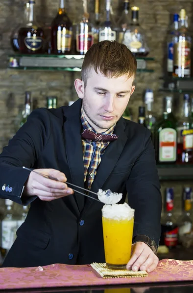 Young man working as a bartender — Stock Photo, Image