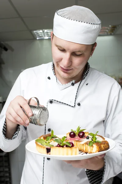 Chef preparing food in the kitchen — Stock Photo, Image