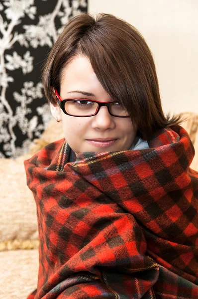 Young girl wrapped in a blanket — Stock Photo, Image