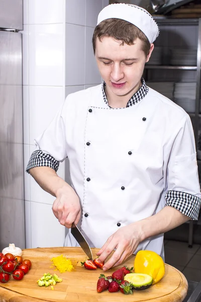 Chef preparing food in the kitchen — Stock Photo, Image