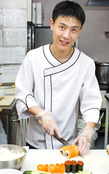 Japanese chef with a plate of sushi — Stock Photo, Image