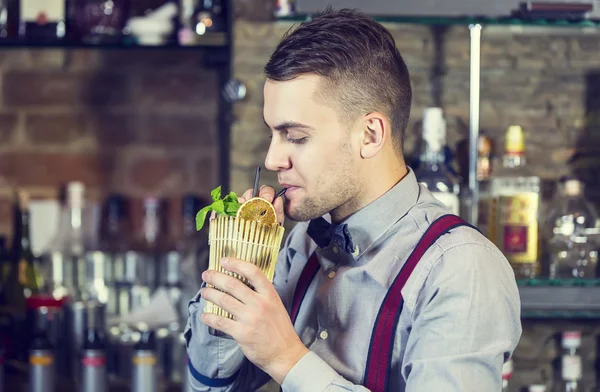 Young man working as a bartender — Stock Photo, Image