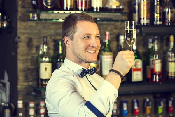 Young man working as a bartender — Stock Photo, Image