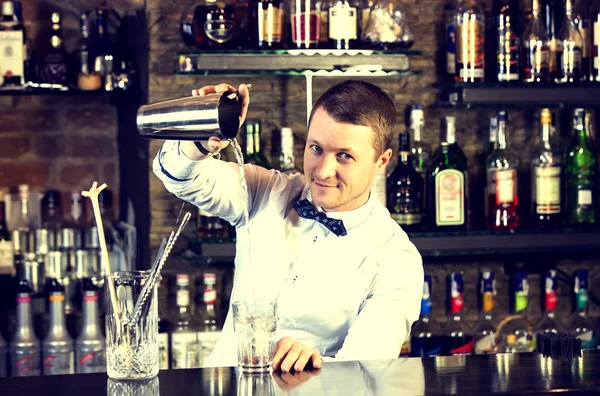 Young man working as a bartender — Stock Photo, Image