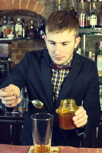 Young man working as a bartender — Stock Photo, Image