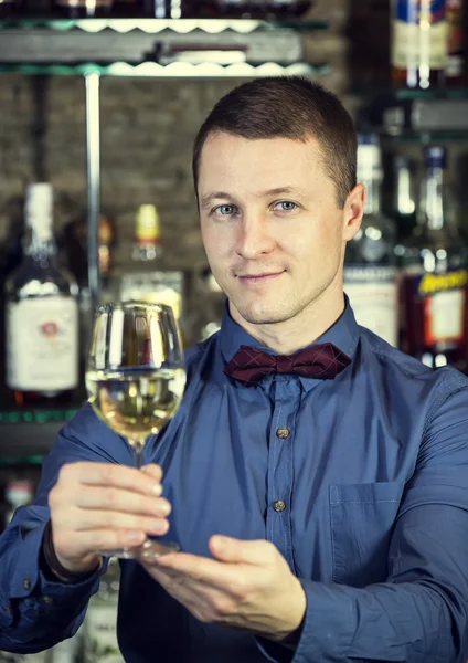 Young man working as a bartender — Stock Photo, Image