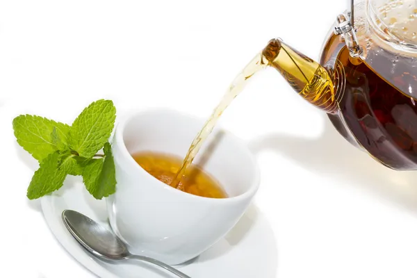 Tea poured from a teapot — Stock Photo, Image