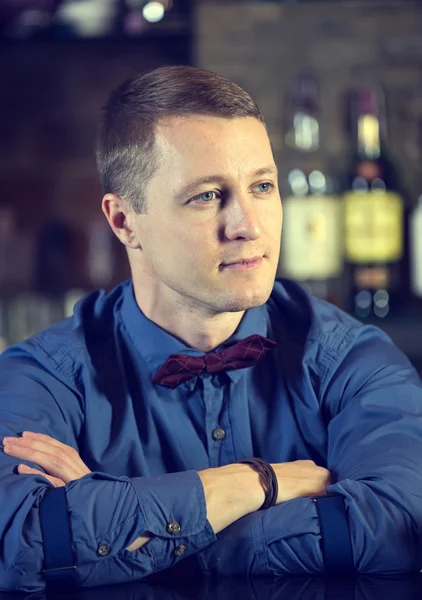 Young man working as a bartender — Stock Photo, Image