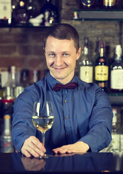 Young man working as a bartender — Stock Photo, Image