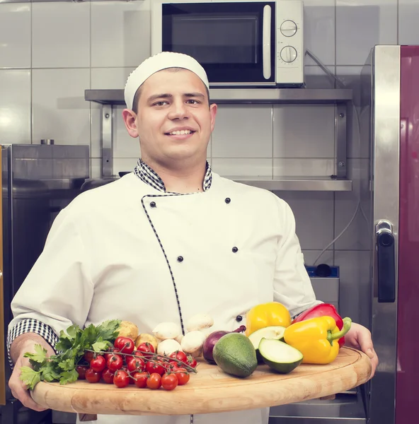 Chef preparing food in the kitchen — Stock Photo, Image