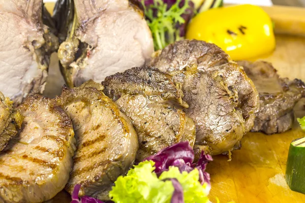 Loin and steak cooked on a grill — Stock Photo, Image