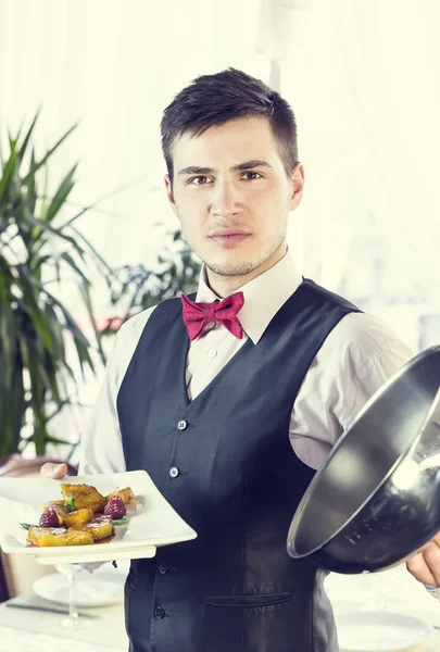 Waiter with a tray of food — Stock Photo, Image