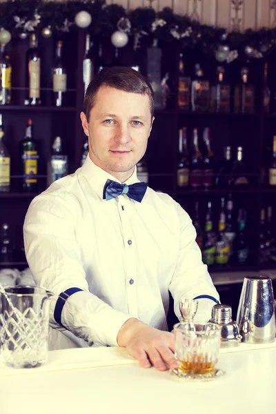 Young man working as a bartender — Stock Photo, Image