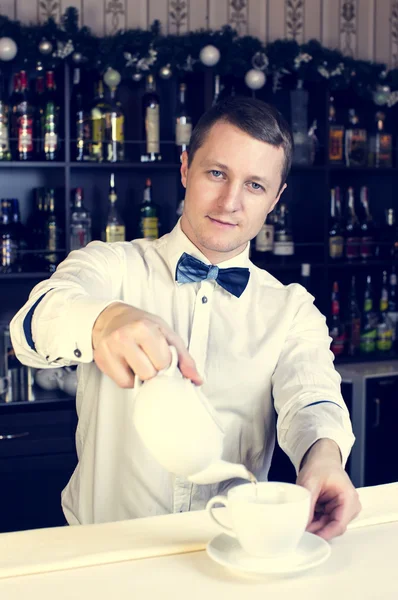 Young man working as a bartender — Stock Photo, Image