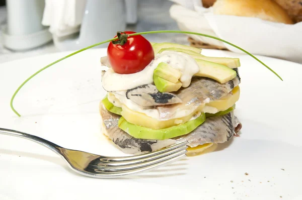 Herring salad with avocado sauce — Stock Photo, Image