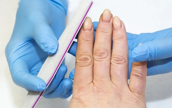 Woman doing manicure — Stock Photo, Image