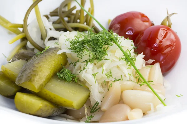 Pickled vegetables, cucumber tomatoes asparagus and garlic cabbage — Stock Photo, Image