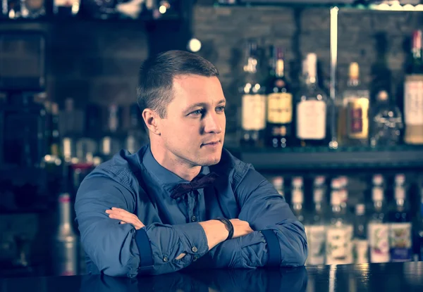 Young man working as a bartender — Stock Photo, Image