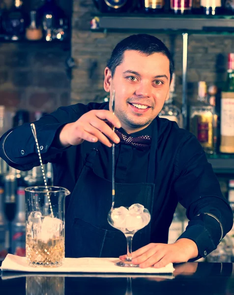 Young man working as a bartender — Stock Photo, Image